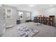 Spacious playroom with natural light, shelving, toy storage, and a fun, educational rug for children at 254 W Odell Ln, Zebulon, NC 27597