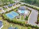 Aerial view of community amenities including a pool, tennis courts, and clubhouse at 2613 Beckwith Rd, Apex, NC 27523