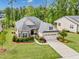 Stunning aerial view of a well-maintained home with lush landscaping and a long driveway at 2613 Beckwith Rd, Apex, NC 27523