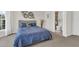 Bright bedroom featuring a queen-size bed, neutral color, and ensuite bathroom at 2613 Beckwith Rd, Apex, NC 27523
