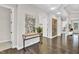 Lovely foyer featuring sleek floors and a stylish table leading to other spaces in the house at 2613 Beckwith Rd, Apex, NC 27523