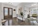 Bright foyer showcasing modern decor, wood floors, and an inviting view into the living spaces at 2613 Beckwith Rd, Apex, NC 27523