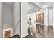Inviting hallway featuring hardwood floors, leading to an open-concept living space at 2613 Beckwith Rd, Apex, NC 27523