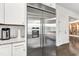 Stainless steel refrigerator with water dispenser set amongst white cabinets and granite countertops at 2613 Beckwith Rd, Apex, NC 27523