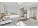 Large main bedroom features neutral paint and carpet, lots of natural light, and adjacent en-suite at 2613 Beckwith Rd, Apex, NC 27523