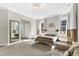 Spacious main bedroom features neutral paint, plush carpet, and lots of natural light at 2613 Beckwith Rd, Apex, NC 27523