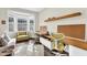 Well-lit home office boasts a bay window and workspace, perfect for productivity and relaxation at 2613 Beckwith Rd, Apex, NC 27523