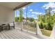 Outdoor patio with white wood flooring overlooking a backyard with lush green trees at 2613 Beckwith Rd, Apex, NC 27523