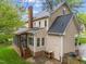 Rear exterior view of the home, highlighting a screened porch and expansive backyard at 2613 Hiking Trl, Raleigh, NC 27615