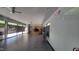 Spacious community room with kitchen area, tile floors, ceiling fans and ample windows at 2613 Hiking Trl, Raleigh, NC 27615
