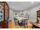 Traditional dining room with hardwood floors, a decorative rug, and abundant natural light at 2613 Hiking Trl, Raleigh, NC 27615
