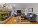 Cozy living room featuring a brick fireplace, hardwood floors, and comfortable seating at 2613 Hiking Trl, Raleigh, NC 27615