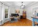 Bright home office featuring hardwood floors, natural light, and ample workspace at 2613 Hiking Trl, Raleigh, NC 27615