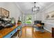 Bright office space featuring hardwood floors, a bay window, and a coffee bar at 2613 Hiking Trl, Raleigh, NC 27615