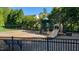 Community playground featuring slides, swings, climbing equipment and bench seating for parents and children at 2613 Hiking Trl, Raleigh, NC 27615