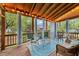 Inviting screened porch with string lights, comfortable seating, and a cozy atmosphere at 2613 Hiking Trl, Raleigh, NC 27615