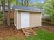 A functional storage shed in the backyard, perfect for storing tools and outdoor equipment at 2613 Hiking Trl, Raleigh, NC 27615