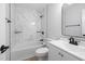 Bathroom featuring tiled walls and a vanity with modern fixtures at 2709 Hidden Hollow Dr, Durham, NC 27703