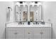 Modern bathroom featuring a double vanity, framed mirrors, and stylish fixtures at 2709 Hidden Hollow Dr, Durham, NC 27703