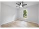 Bright bedroom features a ceiling fan and a window with natural light at 2709 Hidden Hollow Dr, Durham, NC 27703