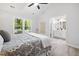 Bedroom featuring a ceiling fan, large window, and an ensuite bathroom at 2709 Hidden Hollow Dr, Durham, NC 27703