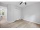 Bedroom with light wood floors, a ceiling fan and a closet at 2709 Hidden Hollow Dr, Durham, NC 27703