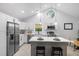 Bright kitchen with white cabinetry, stainless steel appliances, and an island at 2709 Hidden Hollow Dr, Durham, NC 27703