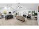 Open-concept living area with a fireplace, kitchen, dining area, and lots of natural light at 2709 Hidden Hollow Dr, Durham, NC 27703