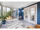 Cozy sunroom with a chair and lots of natural light at 2709 Hidden Hollow Dr, Durham, NC 27703
