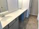 Bathroom features a double vanity with elegant mirrors and neutral tiled floors at 288 Olivia Crossing Ct # 10, Four Oaks, NC 27524