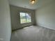 Bedroom with carpeted floor and a window provides a comfortable and inviting space at 288 Olivia Crossing Ct # 10, Four Oaks, NC 27524