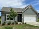 Charming one-story home featuring a two-car garage, manicured lawn, and tasteful landscaping at 288 Olivia Crossing Ct # 10, Four Oaks, NC 27524