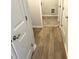 Hallway with wood-look flooring leading to tiled area at 288 Olivia Crossing Ct # 10, Four Oaks, NC 27524