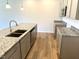 Well-equipped kitchen features granite counters, ample cabinetry, and stainless dishwasher at 288 Olivia Crossing Ct # 10, Four Oaks, NC 27524
