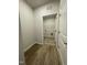 The laundry room features wood-look vinyl flooring and a wire rack for additional storage at 288 Olivia Crossing Ct # 10, Four Oaks, NC 27524