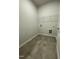 The laundry room features tile flooring and a wire rack for additional storage at 288 Olivia Crossing Ct # 10, Four Oaks, NC 27524