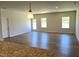 Spacious open-concept living area includes hardwood flooring and recessed lighting at 288 Olivia Crossing Ct # 10, Four Oaks, NC 27524