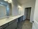 Bathroom features double sink vanity with modern fixtures and a tile floor at 288 Olivia Crossing Ct # 10, Four Oaks, NC 27524