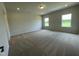 Large main bedroom with plush carpet flooring and large windows, offering lots of natural light at 288 Olivia Crossing Ct # 10, Four Oaks, NC 27524