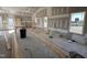 Spacious living room displaying natural light from the windows and featuring unfinished drywall at 2895 Bakers Chapel Rd, Smithfield, NC 27577