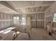 Bright living room features drywall and natural light from the windows overlooking the neighborhood at 2895 Bakers Chapel Rd, Smithfield, NC 27577
