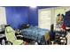 Bedroom with a bed, large window and shoe rack on the wall at 300 E Vance St, Zebulon, NC 27597