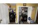 Laundry room with a washer and dryer unit with shelves at 300 E Vance St, Zebulon, NC 27597