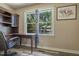 Bright bedroom featuring a built-in desk area with scenic views from the window at 300 Nc 54 Highway # E2, Carrboro, NC 27510
