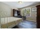 Comfortable bedroom has great light from a window, built-in desk and wood-look floors at 300 Nc 54 Highway # E2, Carrboro, NC 27510