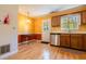 Cozy kitchen featuring stainless steel appliances, wooden cabinets, table, and backyard access at 300 Nc 54 Highway # E2, Carrboro, NC 27510