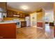Functional kitchen with ample cabinet space, white appliances, and a view into laundry area at 300 Nc 54 Highway # E2, Carrboro, NC 27510