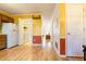 Bright kitchen featuring wood floors, white appliances, and ample space for a washer and dryer at 300 Nc 54 Highway # E2, Carrboro, NC 27510