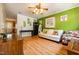 Spacious living area with hardwood floors, comfortable seating, and views of the exterior at 300 Nc 54 Highway # E2, Carrboro, NC 27510