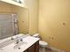 Bathroom with single sink vanity, a large mirror, and a toilet at 3015 Winston Dr # 111, Burlington, NC 27215